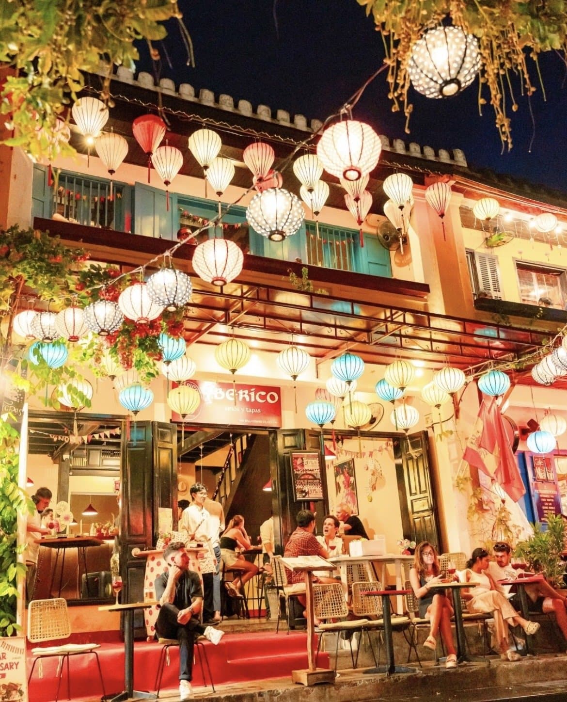 IBÉRICO Hội An terrace strung with lanterns at night